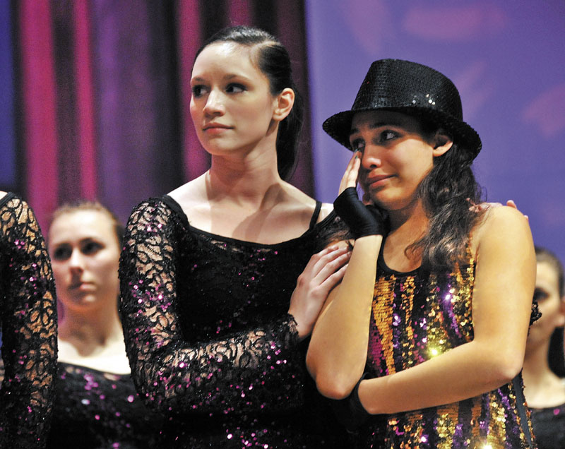 IN MEMORY: Ballet Technique Assistant Instructor Megan McQuarrie, 18, comforts Breona Henderson, 13, right, the recipient of the 2011 Brittney LaBrie Scholarship at the Messalosnkee Performing Arts Center in Oakland on Thursday evening.