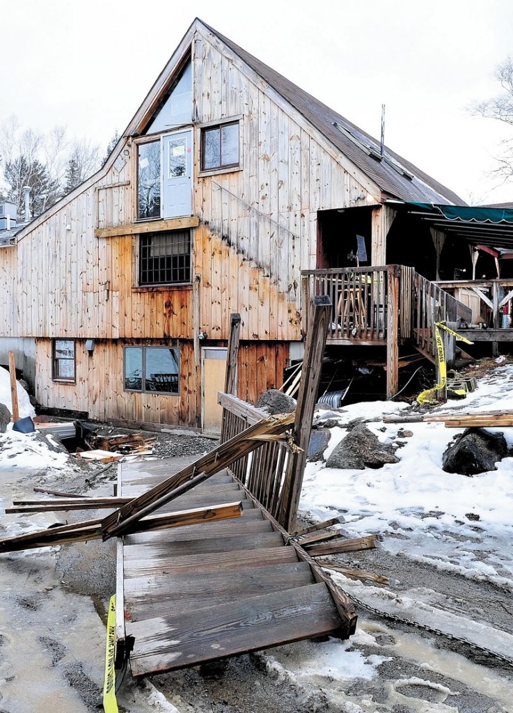 COLLAPSE: A set of stairs leading to a second-floor doorway at The Rack bar and grill restaurant in Carrabassett Valley is shown on the ground Sunday.
