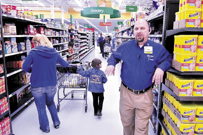 BIGGER: Walmart Supercenter store manager Paul Conklin speaks about the expansion of the Skowhegan store on Monday. The store will have its official opening Wednesday.