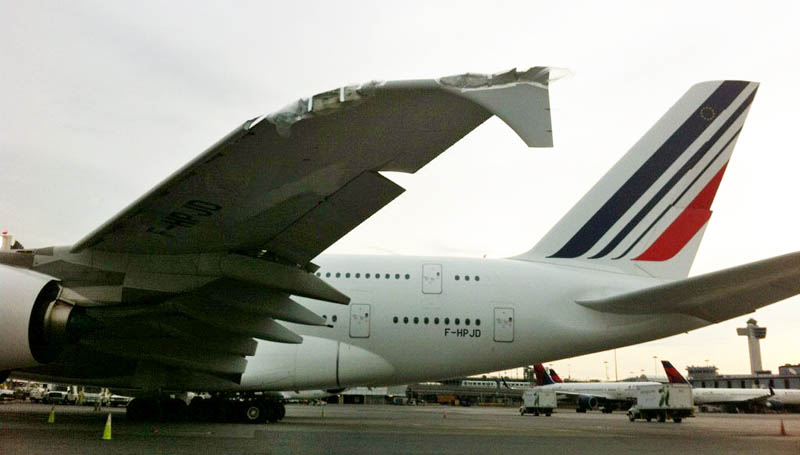 The damaged Airbus A380 belonging to Air France sits on the runway at John F. Kennedy International Airport today.