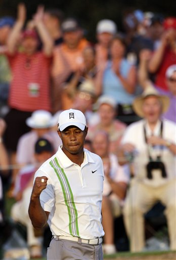 Tiger Woods pumps his fist after a birdie on the 18th hole during the second round of the Masters on Friday in Augusta, Ga.