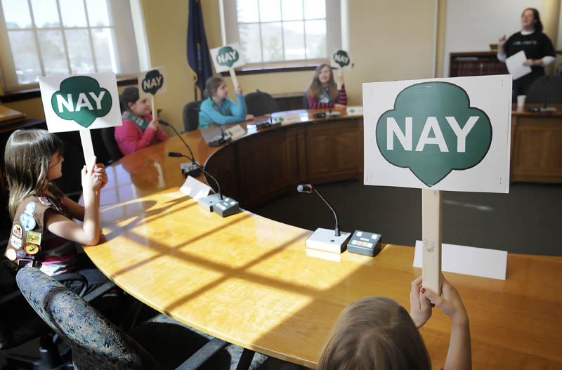 Girl Scouts from around the state vote against a proposal to drop a line of cookies during a debate Thursday at the Statehouse. The fourth annual Girl Scout Cookie Debate introduced Scouts to the legislative process. Rep. Joyce Fitzpatrick, R-Houlton, attended the event.