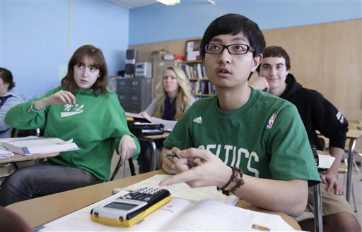 In this Tuesday, March 8, 2011 photo, Chinese student Minzhe Zou answers a question in statistics class Orono High School in Orono, Maine. Minzhe Zou has credited his year at the public school with helping him get accepted to five U.S. colleges.