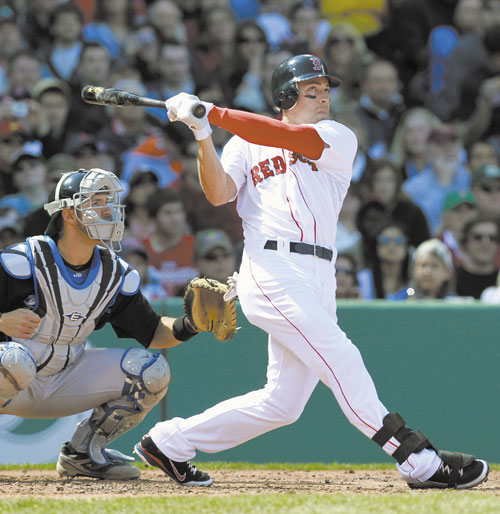 BREAKING OUT: Boston’s Jacoby Ellsbury, right, watches his three-run home run in front of Toronto catcher J.P. Arencibia in the second inning Sunday in Boston.