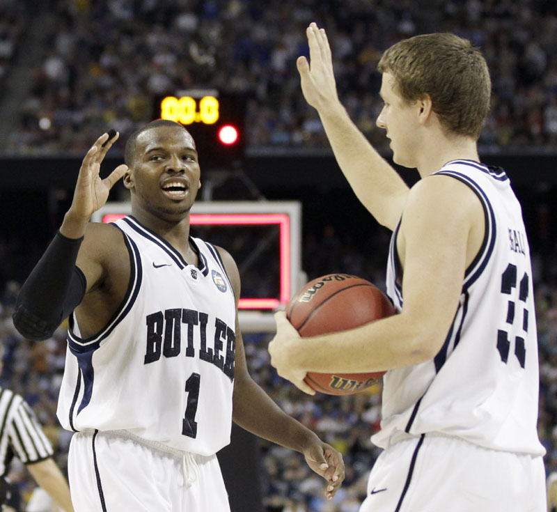 BACK AGAIN: Butler players Shelvin Mack, left, and Chase Stigall react after beating Virginia Commonwealth 70-62 in the Final Four on Saturday night in Houston. With that, Butler’s in the championship game for a second straight season. Mack scored 24 points.