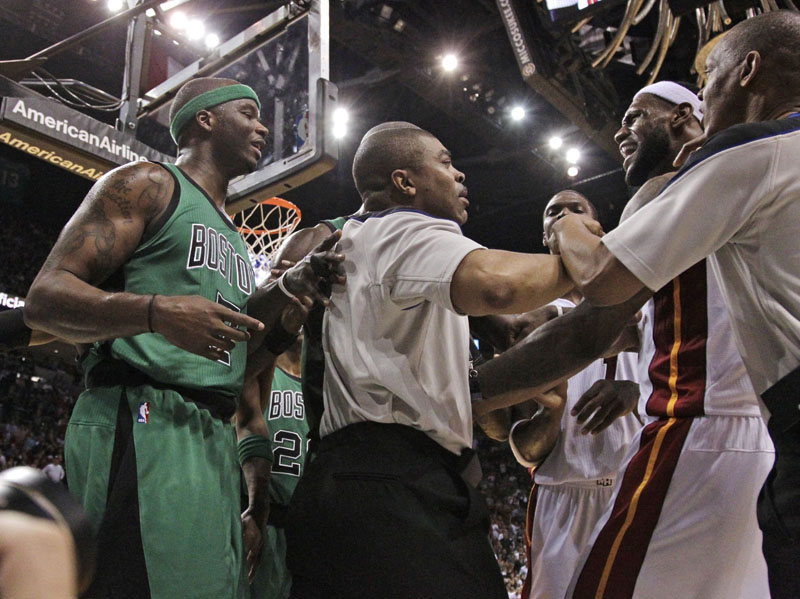 TENSE MOMENT: Heat guard LeBron James, right, exchanges words with Boston Celtics forward Jermaine O’Neal, left, after O’Neal fouled James during the second quarter Sunday in Miami. The Celtics lost 100-77. heat11 heatcletics MHS ADD heat