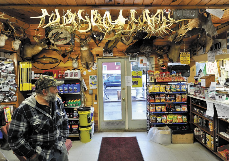 Ronnie Berry waits waits for his brother Gordon inside Berry's General Store on Tuesday evening. Gordon Berry was feeding a local herd of deer that congregate at the ball fields in West Forks.