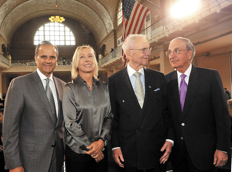 Waterville native and former U.S. Sen. George Mitchell, far right, joins fellow honorees of the annual Ellis Island Family Heritage Awards on Wednesday in the Great Hall of Ellis Island in New York. The others honored for their contributions to the American experience, left to right, are Joe Torre, Martina Navratilova and Lee Iacocca.