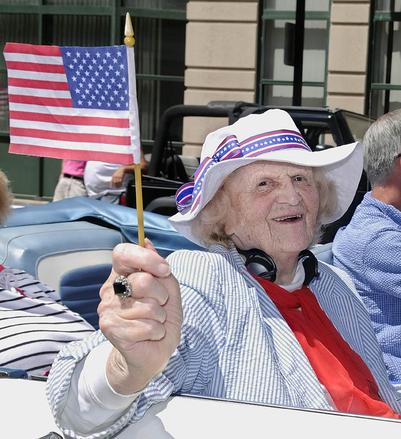 This July 2008 file photo shows Elsie Viles riding down Water Street when she was the 2008 Independence Day parade grand marshal in Augusta. augusta