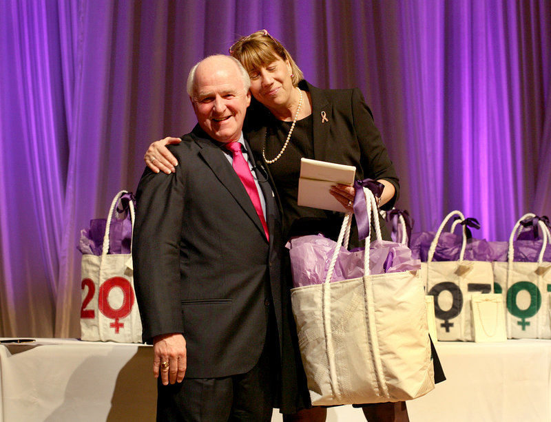 Honoree Meredith Strang Burgess of Burgess Advertising and Marketing hugs Richard Connor, editor and publisher of MaineToday Media, during the Great Women of Maine awards.
