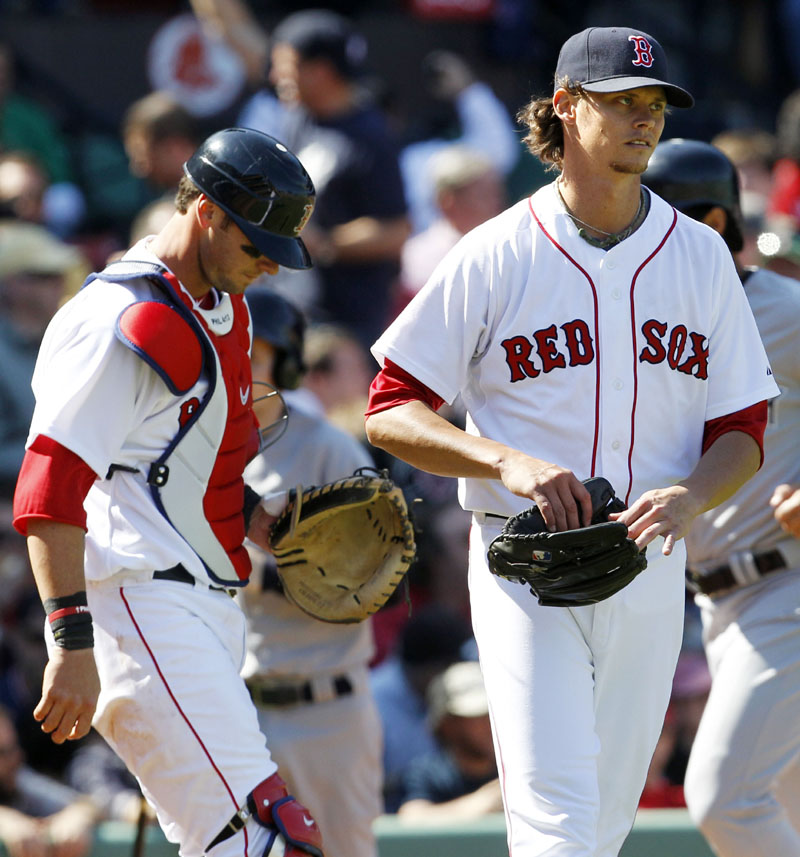 SIGNED LONG-TERM: Red Sox pitcher Clay Buchholz, right, agreed to a four-year deal Sunday that keeps the All-Star right-hander under contract with Boston through 2015.