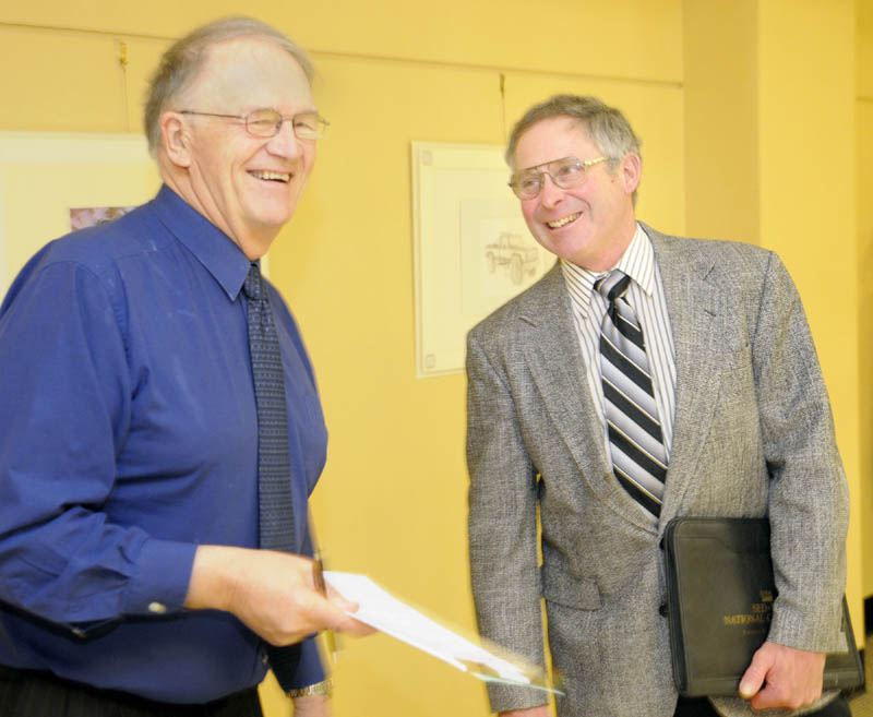 Walter E. Whitcomb, the commissioner of the Department of Agriculture, Food and Rural Resources, right, chats with Sen. Roger Sherman, R-Houlton, in the Cross State Office Building recently. Sherman is Senate chair of the Legislature’s Agriculture Committee.