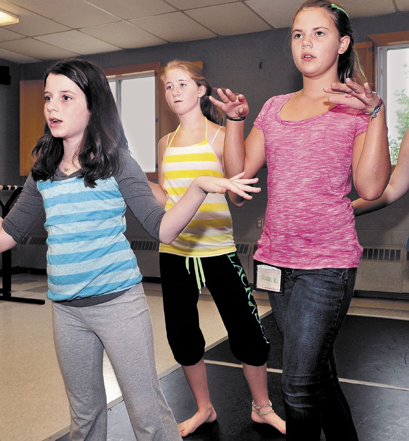 COOL CAMP: Rachylle Hart, center, takes part in a hip-hop class with fellow campers Ellie Rader, left, and Anna Braman at the Maine Arts Camp at Unity College last week.