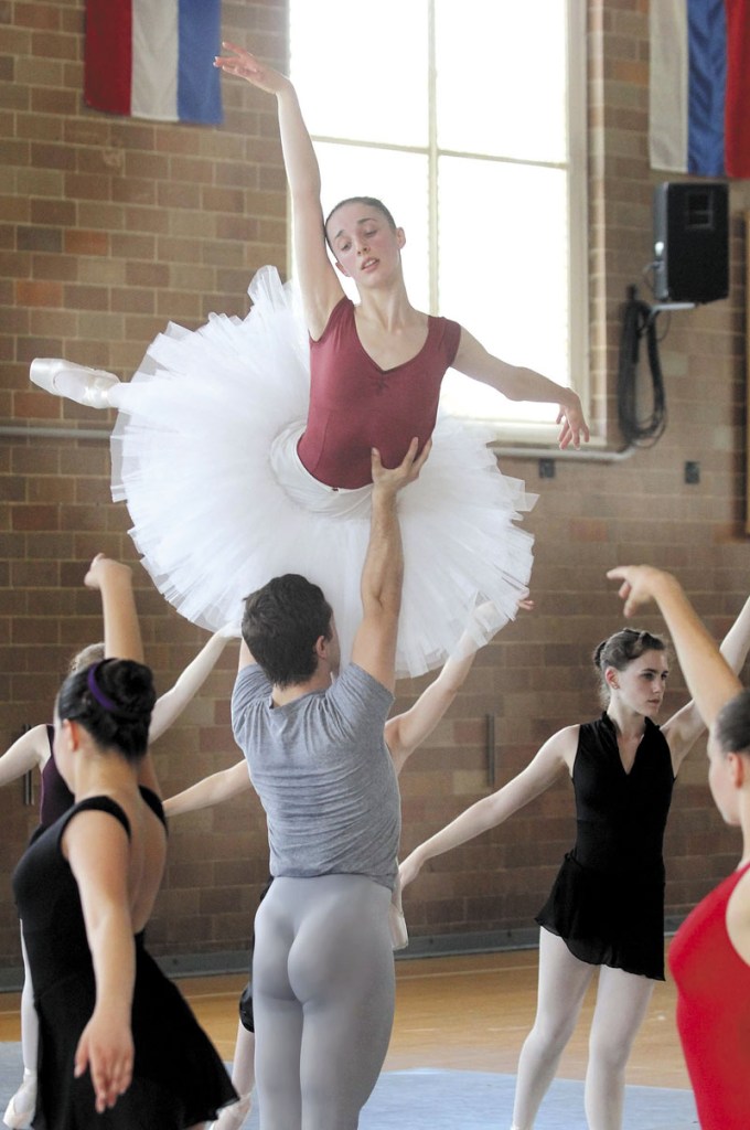 BIG LIFT: Ryan Jolicoeur-Nye and Caroline Doherty rehearse for the Bossov Ballet Theatre's production of "Swan Lake" in Pittsfield on Thursday. Joliecoeur-Nye is a former football player turned ballet dancer.