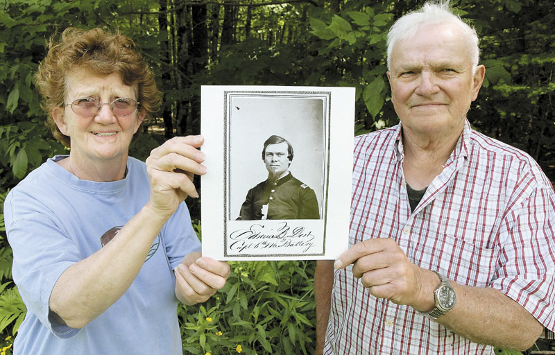 PROUD DOWS: Betty and John Dow of Cornville hold a photograph of Lt. Edwin Barlow Dow, an ancestor of John Dow, who led the 6th Maine Artillery Battery into action on the second day of the Battle of Gettysburg in July 1863.