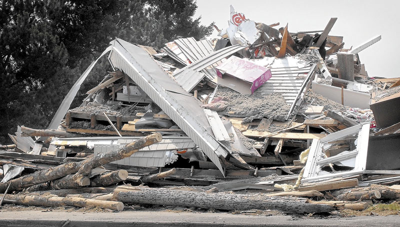 DESTRUCTION: The Jackman home where 5-year-old Liam Mahaney was killed when a logging truck spilled its load early Tuesday was reduced to rubble by midday Wednesday.