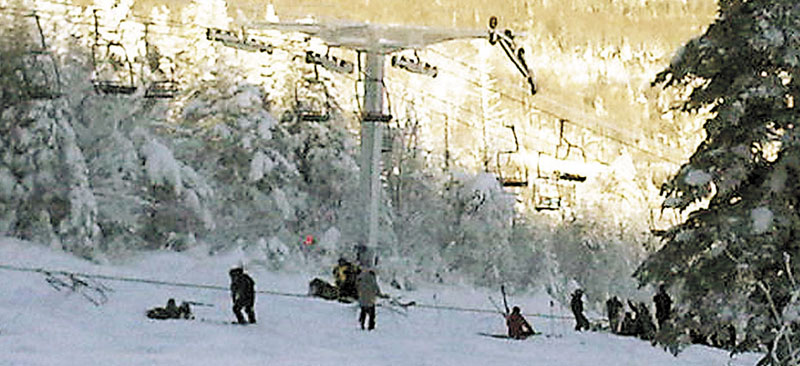 LIFT DOWN: Skiers and lift chairs are shown after a chairlift derailed at Sugarloaf in December.