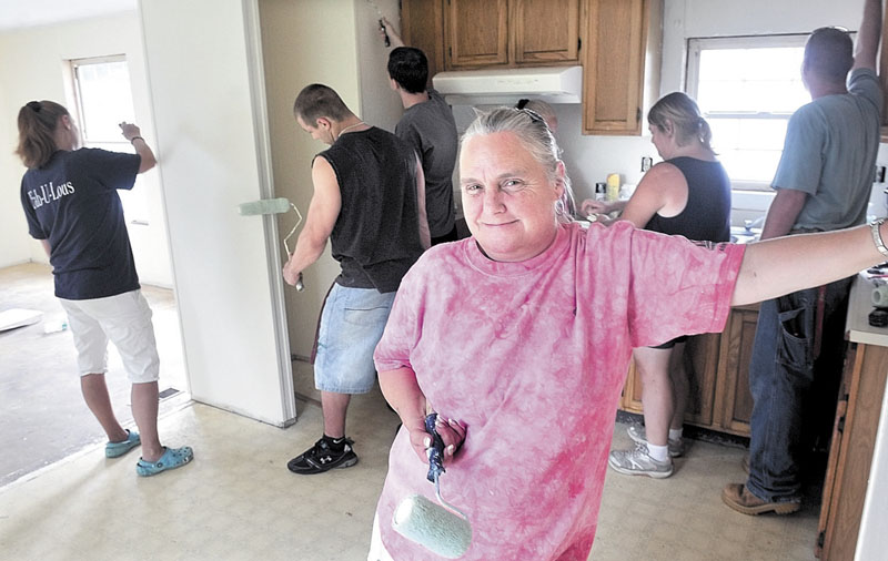 FIXER-UPPER: Dot Gordon, residents and volunteers are renovating 16 mobile homes on High Street in Farmington.