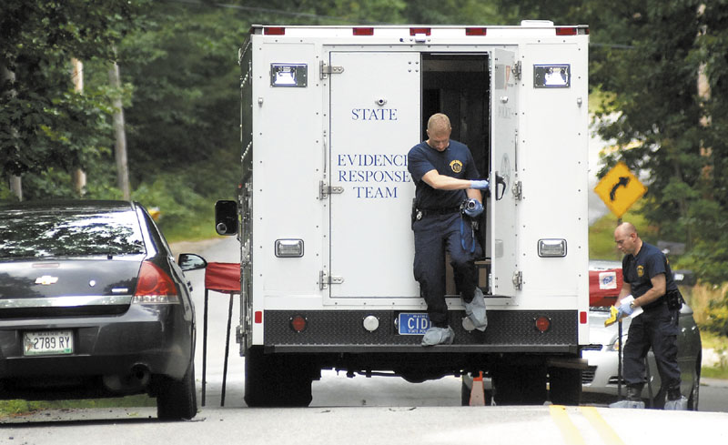 State Police collect evidence Tuesday at the scene of a shooting at 322 Bennett Road in New Gloucester. Renee Sandora, the mother of four children, was shot Monday and died Tuesday.
