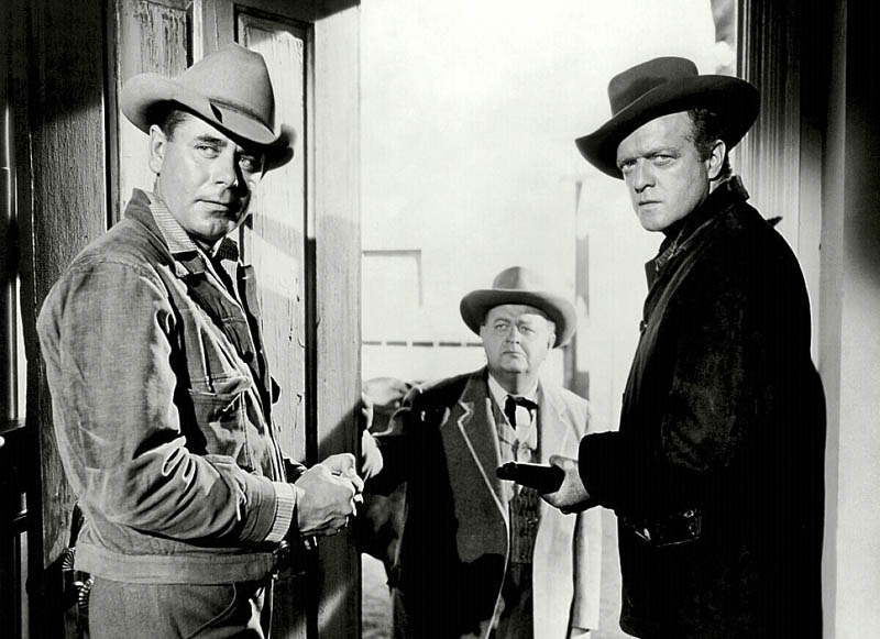 WHAT A MAN HAS TO DO: Glenn Ford, left, and Van Heflin star in the Western film classic “3:10 to Yuma.” Robert Emhardt is in the middle.