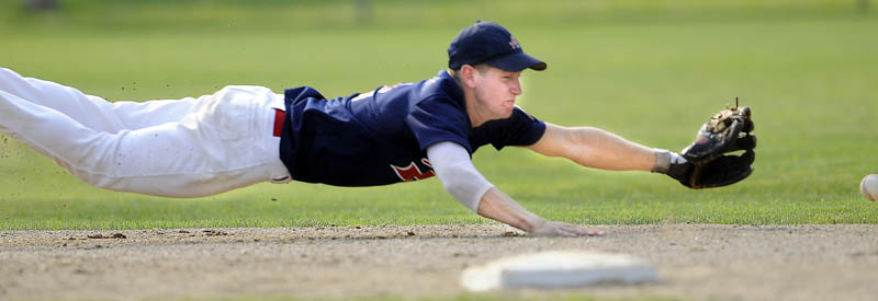 BELLY PLAY: Augusta shortstop Colin McKee dives for a groundball during an American Legion Zone 2 playoff game Monday in Augusta.
