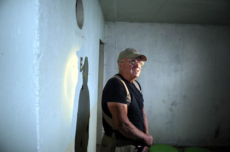 LOOKING AROUND: Roland Arno surveys the subterranean room of a bomb shelter at his home on Mount Vernon Avenue in Augusta. His friend, Donald Tuttle, built the shelter in the 1950s that is scheduled to be demolished.