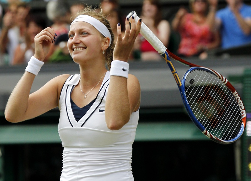 Petra Kvitova celebrates after defeating Maria Sharapova in the women's singles final at the All England Lawn Tennis Championships at Wimbledon today. The 6-3, 6-4 win gives Kvitova her first Grand Slam title.