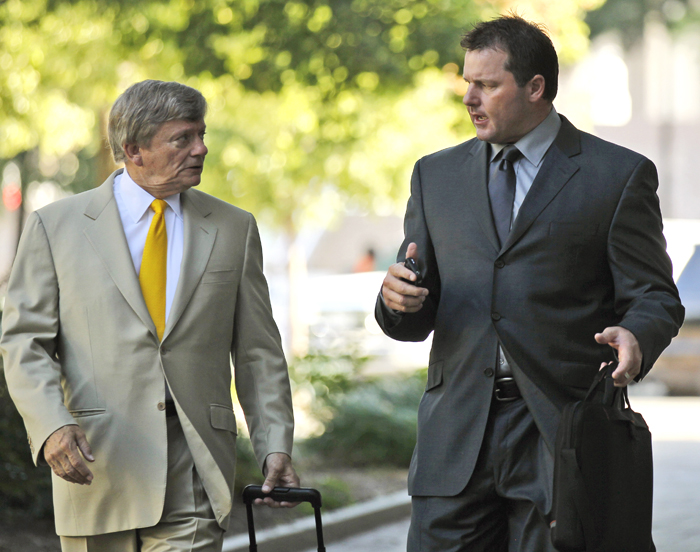 Former Major League Baseball pitcher Roger Clemens, right, and his attorney Rusty Hardin, arrive at federal court in Washington today.