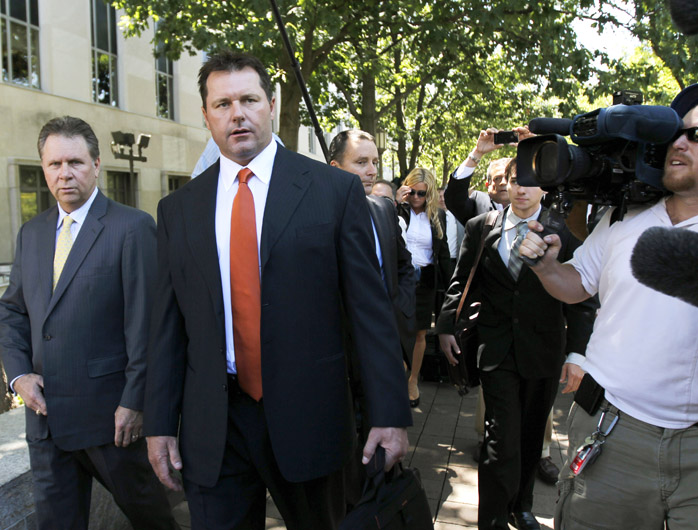 Former Major League baseball pitcher Roger Clemens leaves federal court in Washington today after the judge declared a mistrial in his perjury trial.