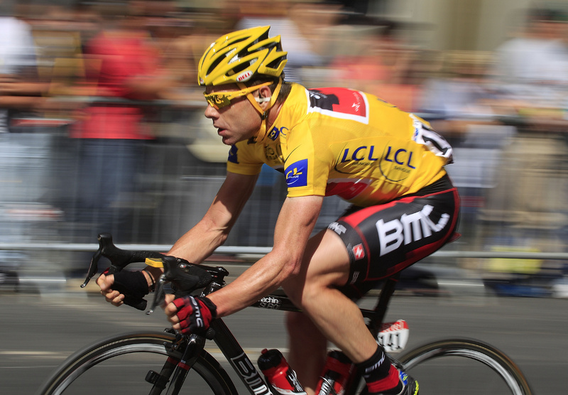 Cadel Evans of Australia, wearing the overall leader's yellow jersey, rides in the pack during the 21st stage of the Tour de France today, starting in Creteil and finishing in Paris. Evans is the first Australian to win the race.