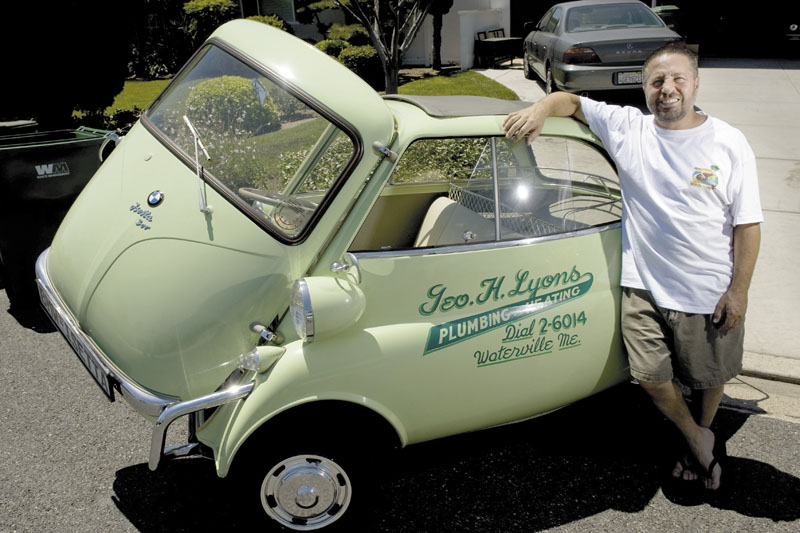 PROUD OWNER: A 1957 BMW Isetta, once driven around Waterville, is the car Tustin, Calif., mini-car collector David Raab says he would save if he could only pick one in a fire. “A car’s only original once,” he said of the green micro-car.