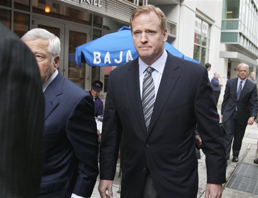 NFL football Commissioner Roger Goodell, right, New England Patriots owner Robert Kraft, and others, arrives at the NFL Players Association in Washington, Monday, July 25, 2011.