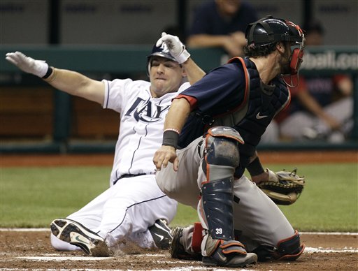 Tampa Bay's Casey Kotchman, left, scores past Boston Red Sox catcher Jarrod Saltalamacchia on a third inning single by Sam Fuld on Friday in St. Petersburg, Fla.