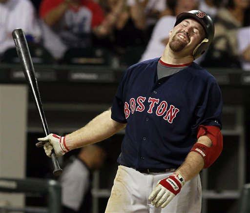 Boston Red Sox's Kevin Youkilis reacts as he strikes out with the bases loaded against the Chicago White Sox in the sixth inning of a baseball game on Friday, July 29, 2011, in Chicago. (AP Photo/John Smierciak) Baseball