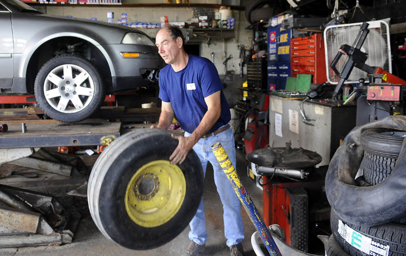 SLOW GOING: Greg Chapman said business has been slow at his garage on Bridge Street in Gardiner. Recently, Chapman repaired a tractor tire in addition to servicing a vehicle. Up the road, retail sales in the Augusta area fell $1.5 million, or 0.6 percent, in May 2011 when compared to May 2010. But that was after a surge that saw sales rise 2.8 percent, or $2 million, in April 2011 from April 2010.