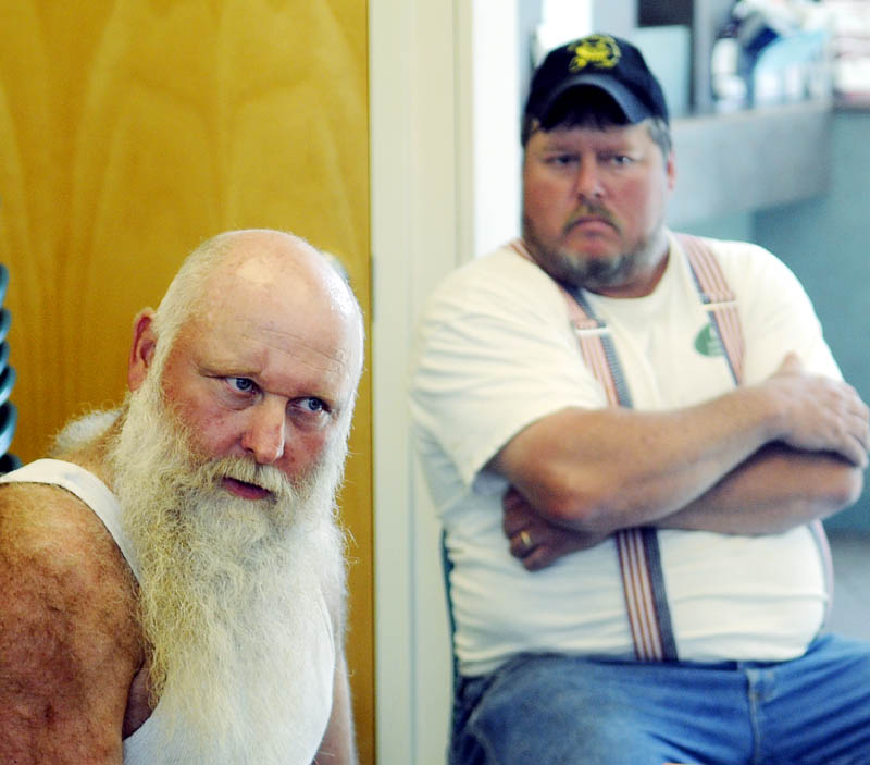 Jim Worthing, left, listens to a Randolph selectman explain a $15 fee for smelt shacks that the town has implemented during a selectmen’s meeting Tuesday at Randolph Town Hall. Worthing operates a commercial smelt camp on the Kennebec River in Randolph. At right is Joey Doody.