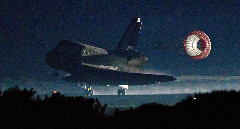 LAST LANDING: The drag chute is deployed as the space shuttle Atlantis lands Thursday at Kennedy Space Center in Florida, completing STS-135, the final mission of the NASA shuttle program. NASA STS-135 atlantis explorati