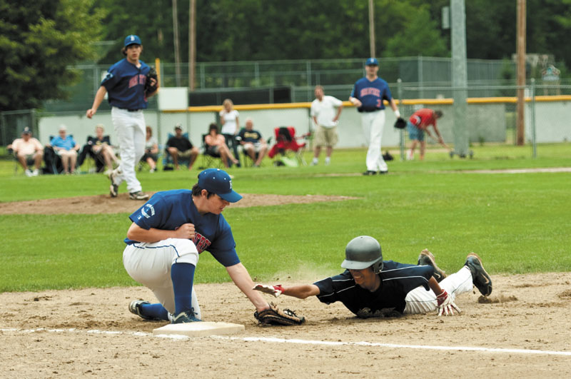 PICKED OFF: Braintree, Mass. first baseman Dylan Casserly tags out Essex, Vt.’s Josh Baez on a pickoff play in the opener of the New England Babe Ruth 13-15-year-old Babe Ruth New England Regional on Friday at Hippach Field, in Farmington.