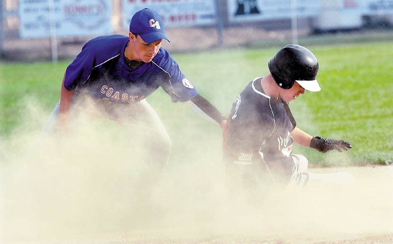 SAFE AT SECOND: Central Maine’s Dylan Hapworth slides safely into second base as Coastal South’s Pearsson Cost attempts to tag him out during a 14-year-old Babe Ruth state tournament game Wednesday at Lawrence High School in Fairfield. Central Maine won 8-0 and will play Augusta at 2:30 p.m. today.