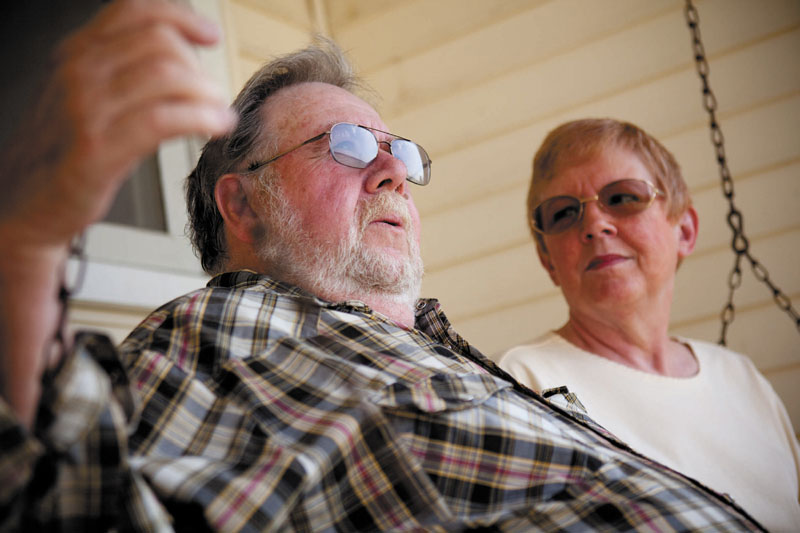 SAVINGS: Ray and Jo Kelly relax on a swing in front of their home last month in Conklin, Mich., where they live in retirement. The two both take Lipitor and look forward to having extra money when the drug is replaced with a generic in the fall.