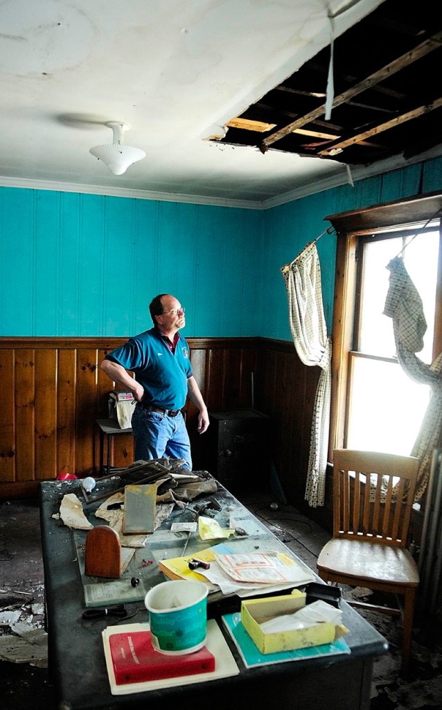 Hallowell Fire Chief Mike Grant stands in what used to be his second-floor office on Thursday during a tour of the Hallowell fire station. He quit using the office when the ceiling first collapsed, shortly after the ice storm of 1998.