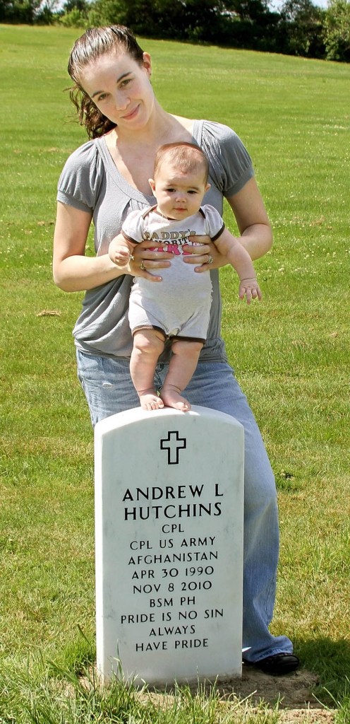 Heather Hutchins stands at the grave of her late husband, Andrew, with their 4-month-old daughter, Allyssa.