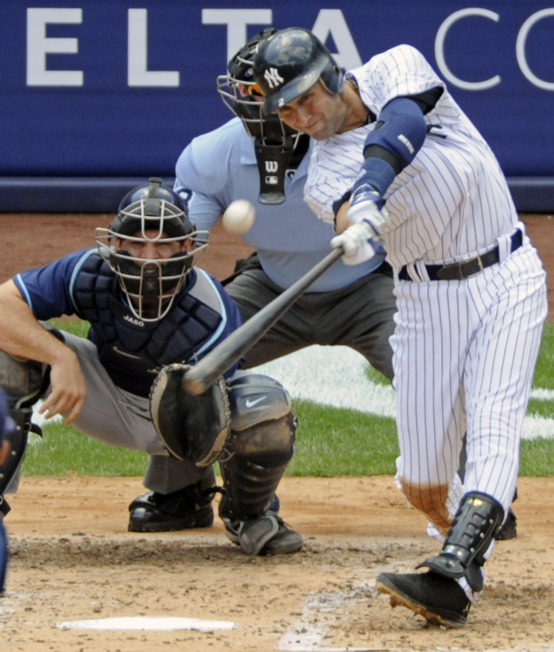 Mr. 3,000: Derek Jeter hits a home run for his 3,000th career hit in the third inning Saturday against the Tampa Bay Rays at Yankee Stadium in New York. Jeter became the first Yankee to reach 3,000 career hits.