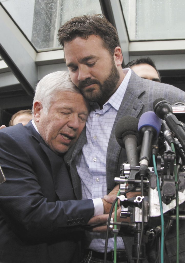 TOUCHING MOMENT: Patriots football owner Robert Kraft owner, left, is hugged by Jeff Saturday of the Indianapolis Colt during a news conference Monday in Washington after the NFL Players Association executive board and 32 team reps voted unanimously to approve the terms of a deal with owners to the end the 41⁄2-month lockout.