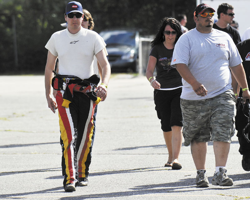 READY TO RACE: Kyle Busch walks in the pits before the start of the TD Bank 250 on Sunday at Oxford Plains Speedway.