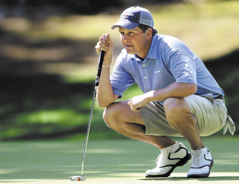 IN POSITION: Jason Gall sizes up a putt during the second round of the Maine Amateur Championship on Wednesday at the Portland Country Club in Falmouth. Gall is three shots behind leader Ryan Gay.