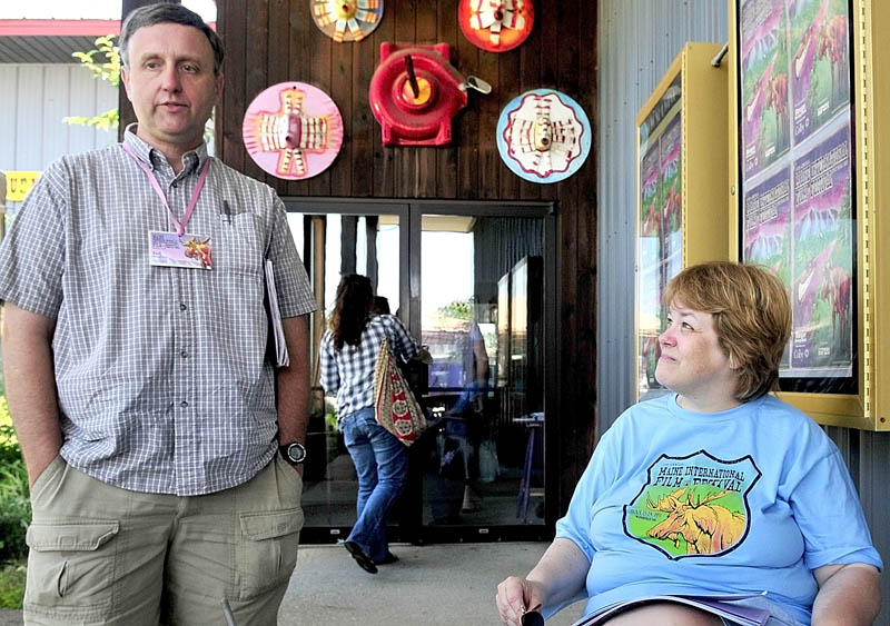 Lynn Sawlivich, left, and Nancy Sanford, who have attended all 14 years of the Maine International Film Festival in Waterville, discuss movies at Railroad Square Cinema.