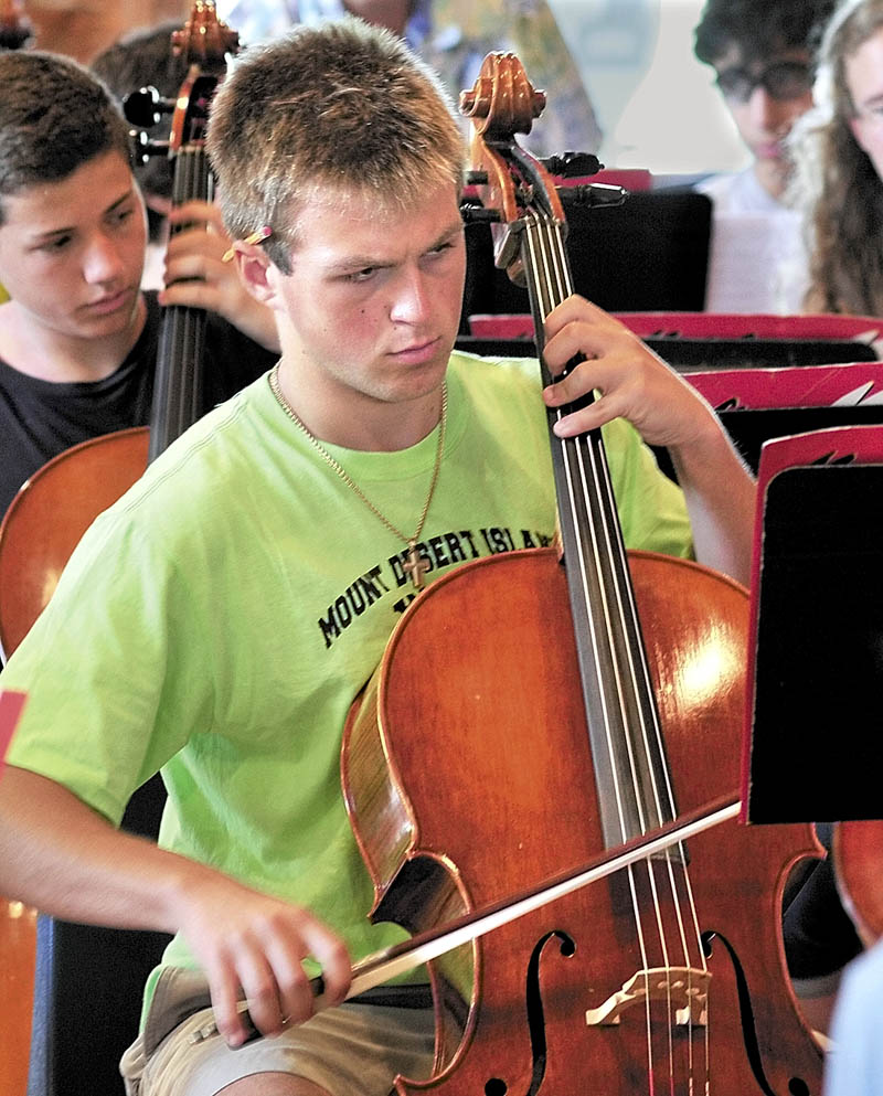 INTENT: Madison Luck of Mount Desert Island plays cello at Alumni Hall at the New England Music Camp in Sidney.