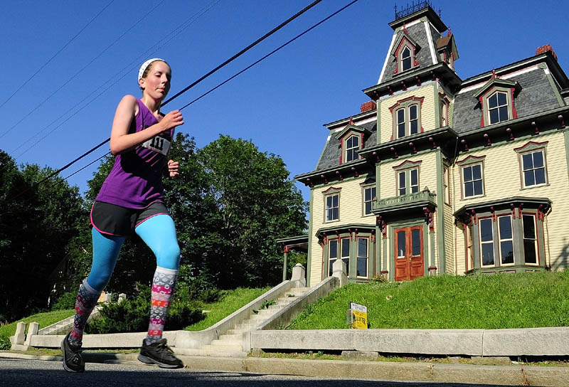 Caidyn Wilson runs past the Bodwell House on her way to being the first female finisher at the Old Hallowell Day Five Kilometer Race on Saturday morning. The 3.1 mile course started on Water Street and then alternated north and southbound legs on Second and Middle Streets on the way to a finish line in Vaughan Field.
