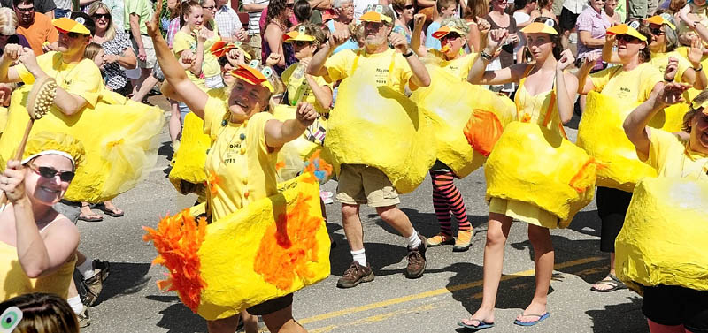 A group of dancing rubber duckies from the NoHa neighborhood group performs in front of the judges’ stand during the Old Hallowell Day parade on Saturday morning. The NoHa group of dancing duckies, and a couple of bathers in towels along with Bert and Ernie, won the Grand Marshall award as best overall entry. The NoHa group is made up of residents from Pleasant and Page Streets and the name is short for North Hallowell.